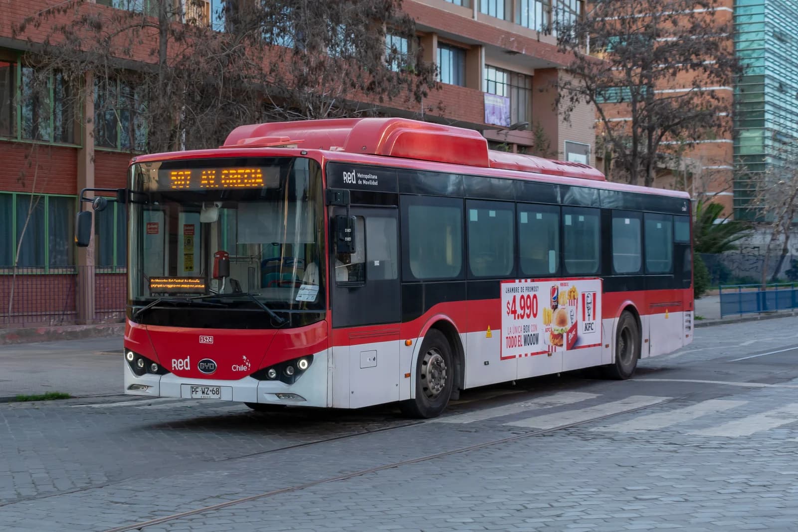 Red and white passenger bus operating route 507 in Santiago.