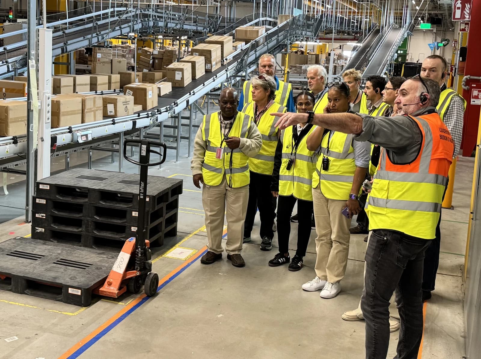 Group of staff on a professional development visit at an Amazon fulfillment center.