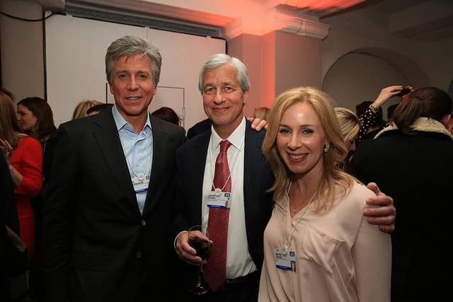 Bill McDermott, James Dimon, and Becky Quick standing together at an indoor event.