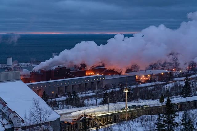 Iron ore mining plant in Silver Bay, Minnesota, with Lake Superior in the background.
