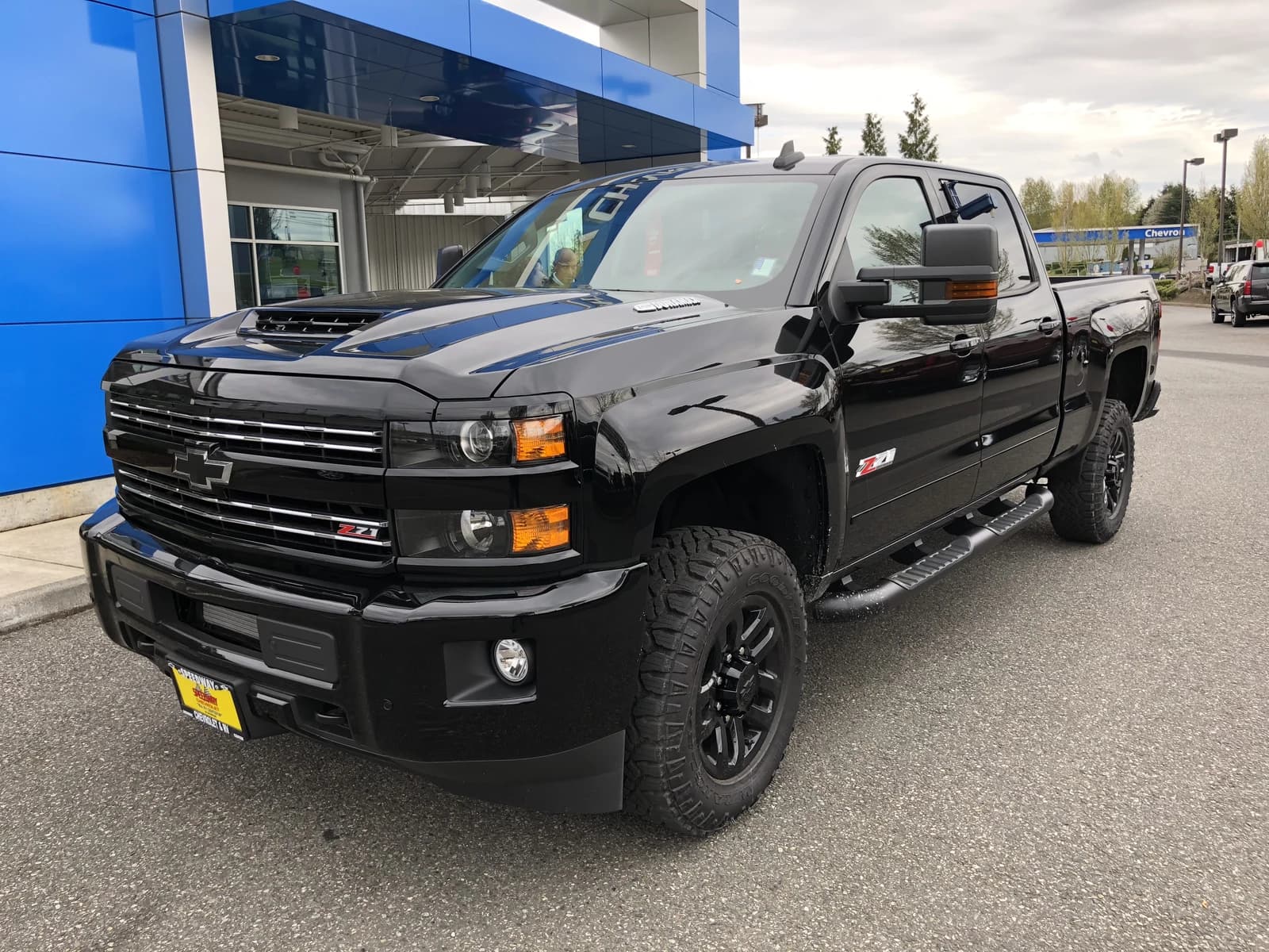 Black 2018 Chevrolet Silverado 2500 Z71 HD Midnight Edition pickup truck parked outdoors.