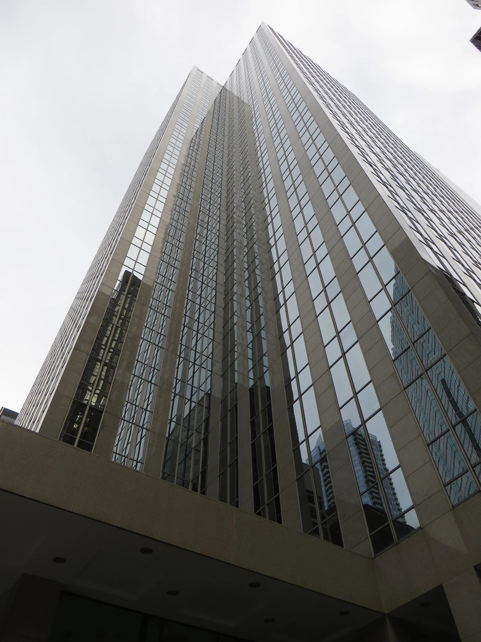 Exterior view of Exchange Tower in Toronto, Ontario, with reflections in its glass facade.