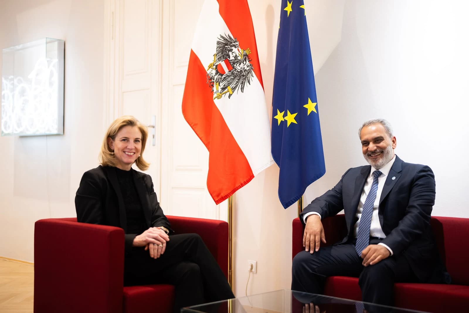 Beate Meinl-Reisinger, Austrian Foreign Minister, and Haitham Al Ghais, OPEC Secretary General, seated indoors.