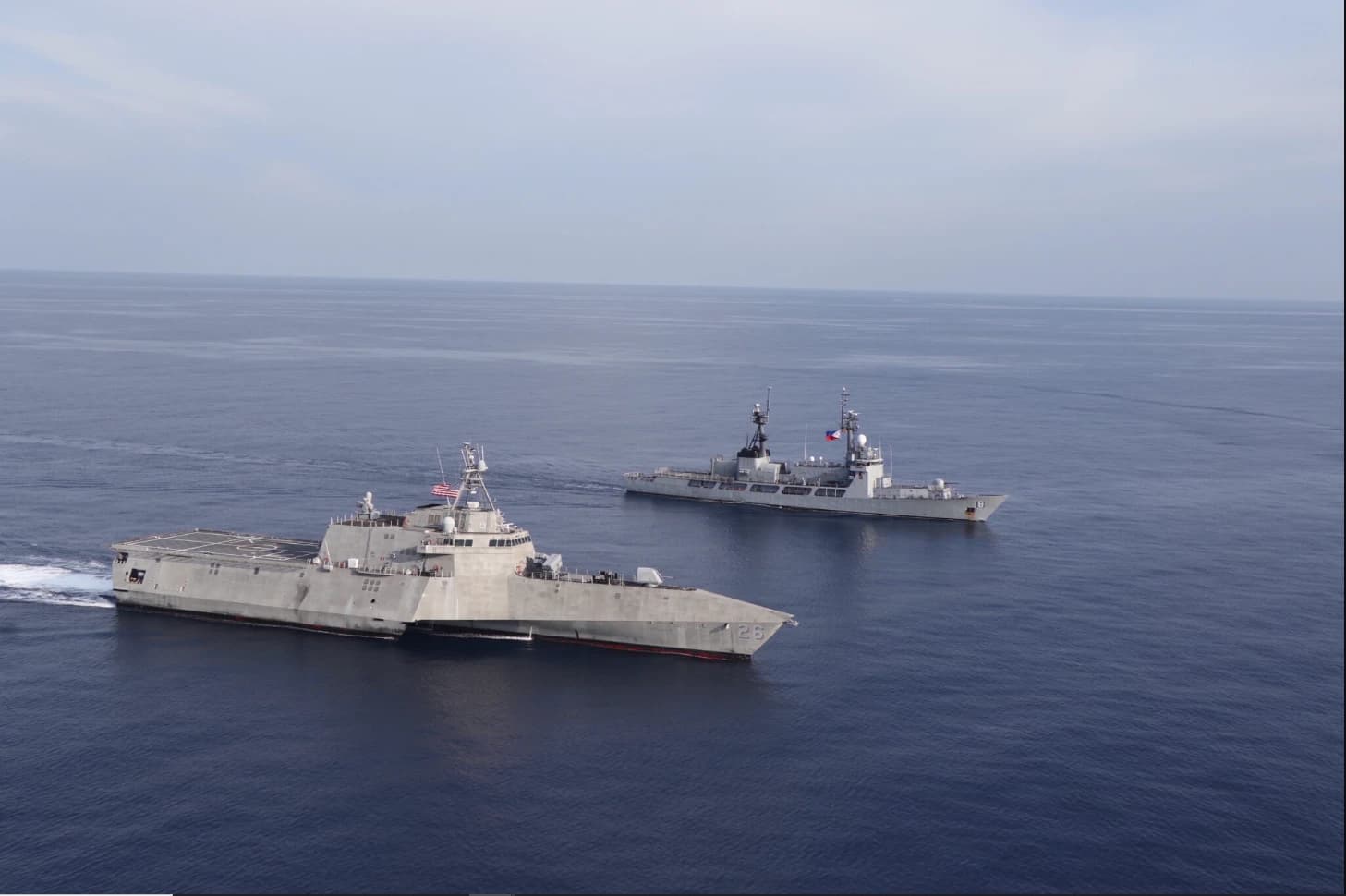 USS Mobile (LCS-26) and BRP Ramon Alcaraz (PS-16) sail together in the South China Sea.