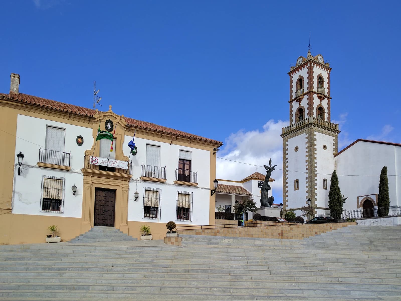 City Hall building in Fuente Obejuna, Spain with bell tower and steps.