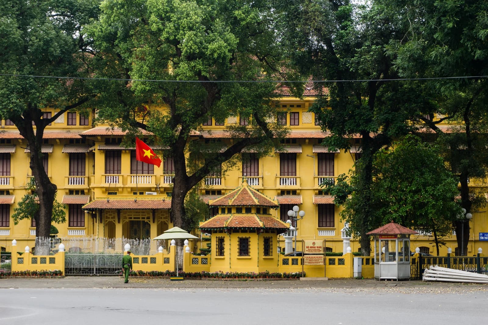 Ministry of Foreign Affairs building in Hanoi, Vietnam, with a Vietnamese flag flying.