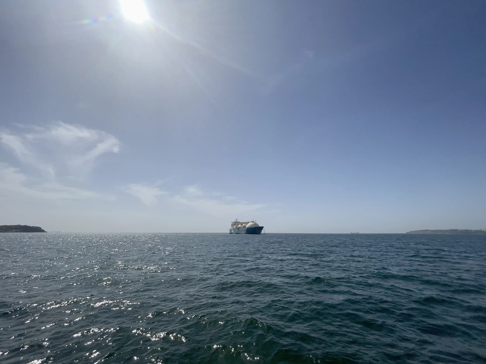 The KARMOL LNGT POWERSHIP AFRICA, an LNG tanker, floats on the ocean.