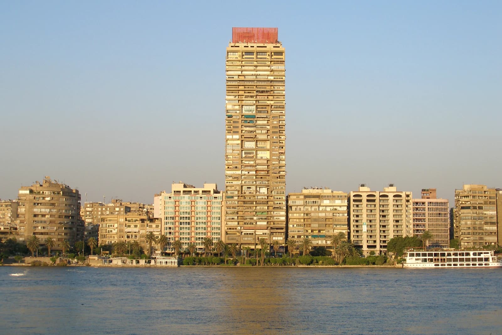 Residential buildings and a tall apartment block along the Nile River in Cairo, Egypt.