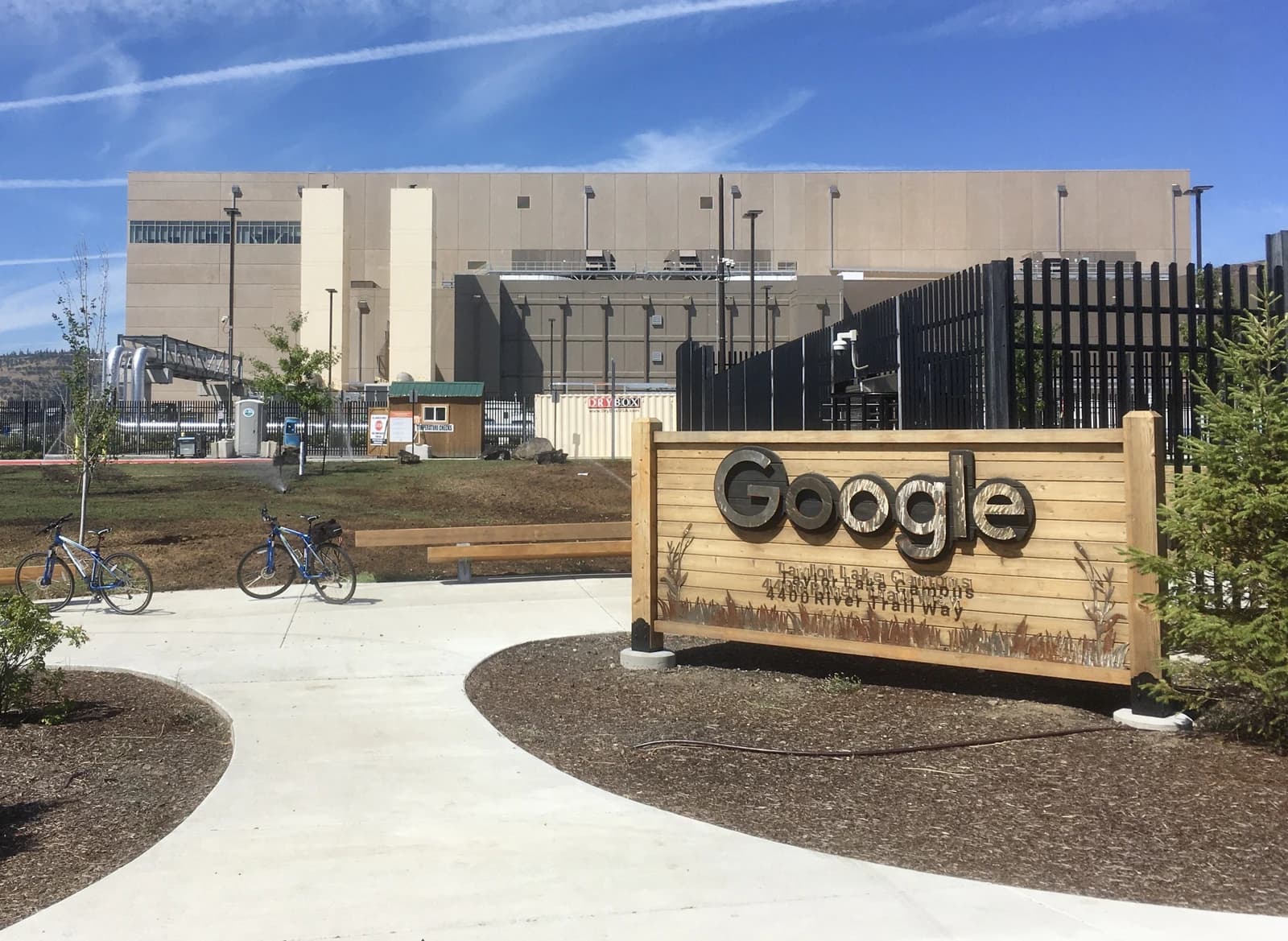 Exterior of a Google data center building under a clear sky.