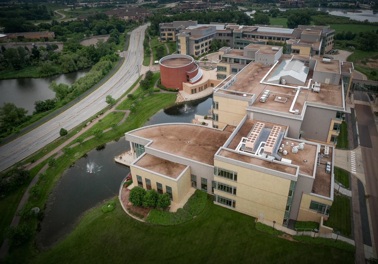 Aerial view of Optum Headquarters in Eden Prairie, Minnesota, with buildings and a pond.
