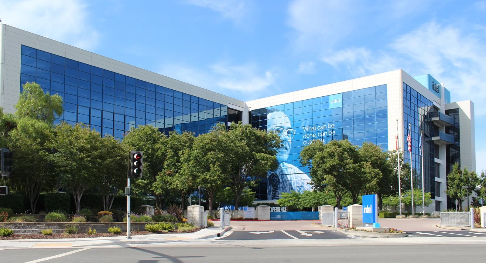 Intel's corporate building on Mission College Boulevard with green trees and blue skies.