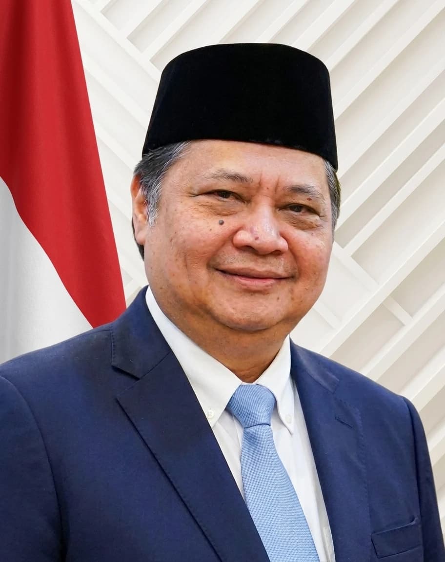 Airlangga Hartarto, Coordinating Minister for Economic Affairs, smiles in an official portrait.