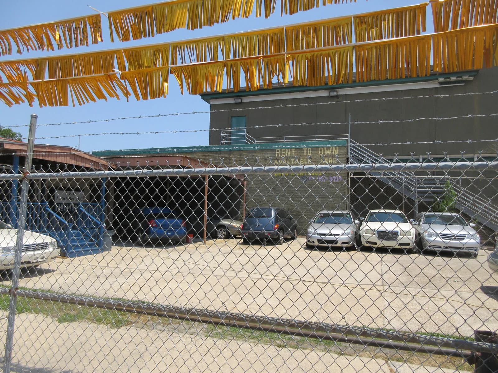 Used cars parked in a car lot in Mid-City New Orleans.