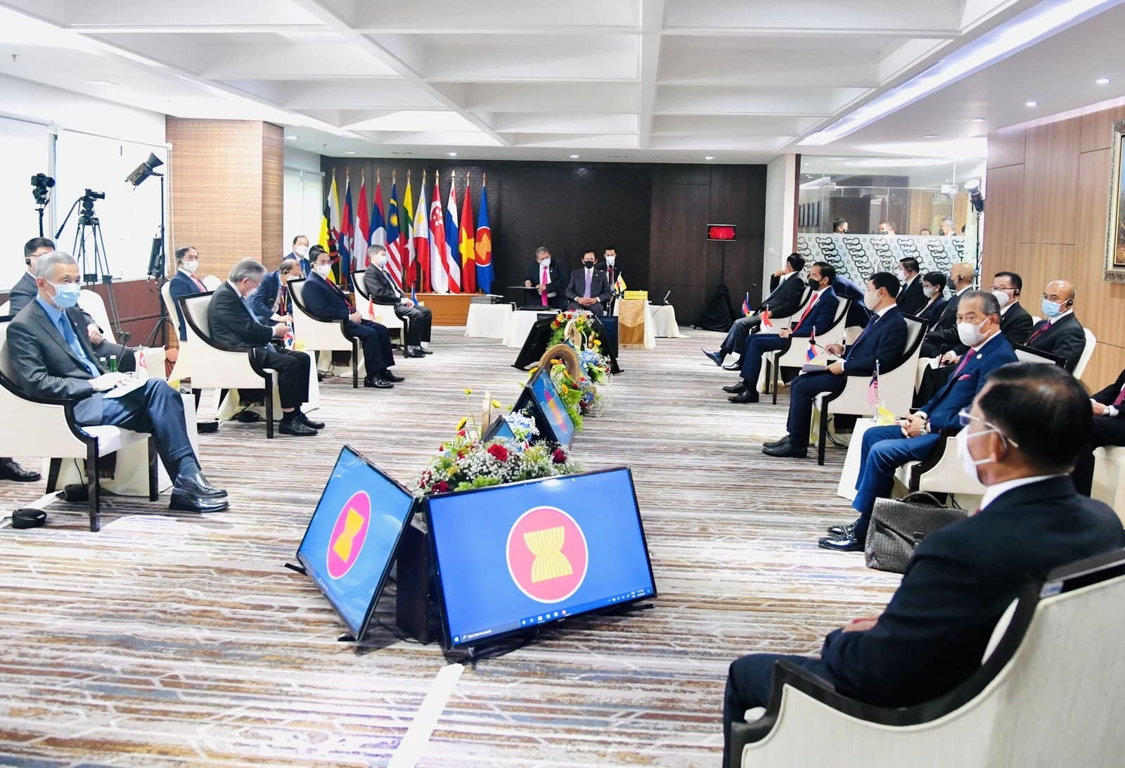 ASEAN leaders and officials attending a ministerial meeting in a conference room.
