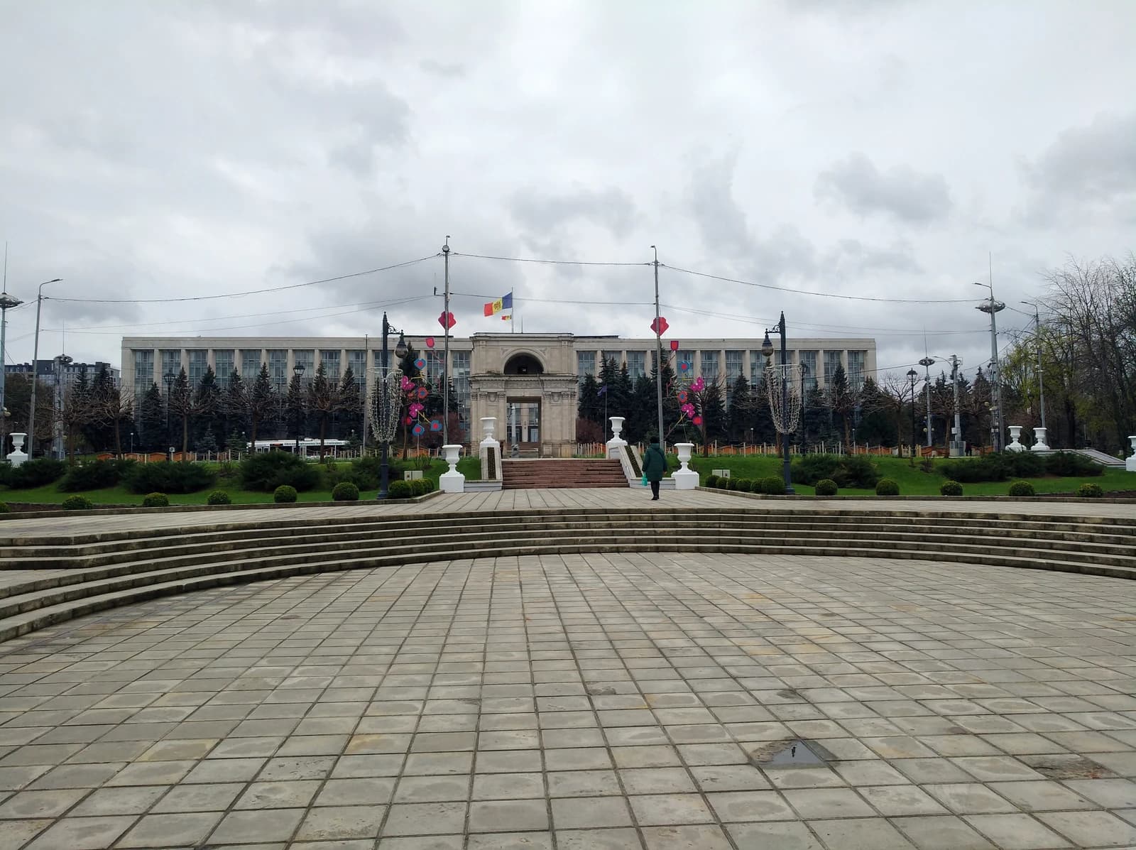 Triumphal Arch and Government Building of Moldova under a cloudy sky.