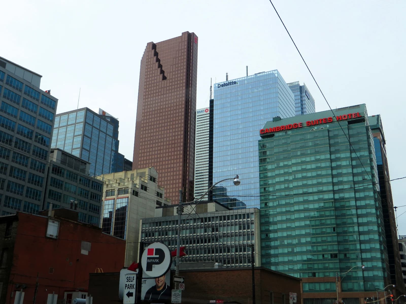 Scotia Plaza, a tall brown skyscraper, dominates a view of Toronto's financial district.