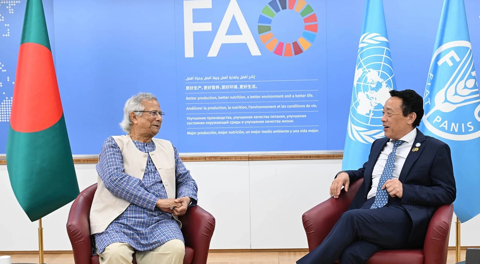 Muhammad Yunus, Nobel Peace Laureate, and Qu Dongyu, FAO Director-General, sitting together.