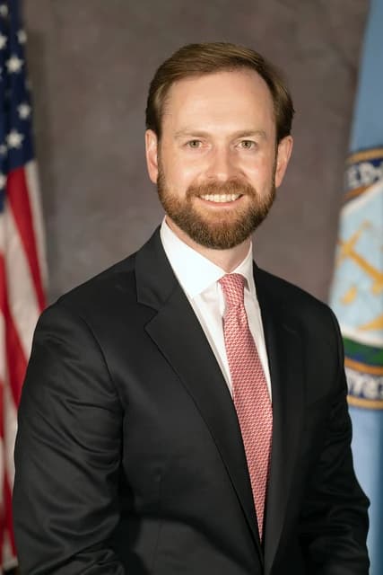 Andrew N. Ferguson, FTC Commissioner, smiling for an official portrait.