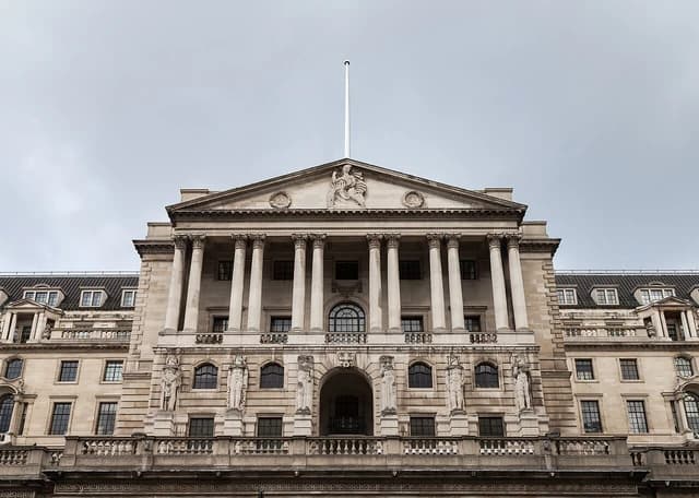 Bank of England building in London, England, under a grey sky.