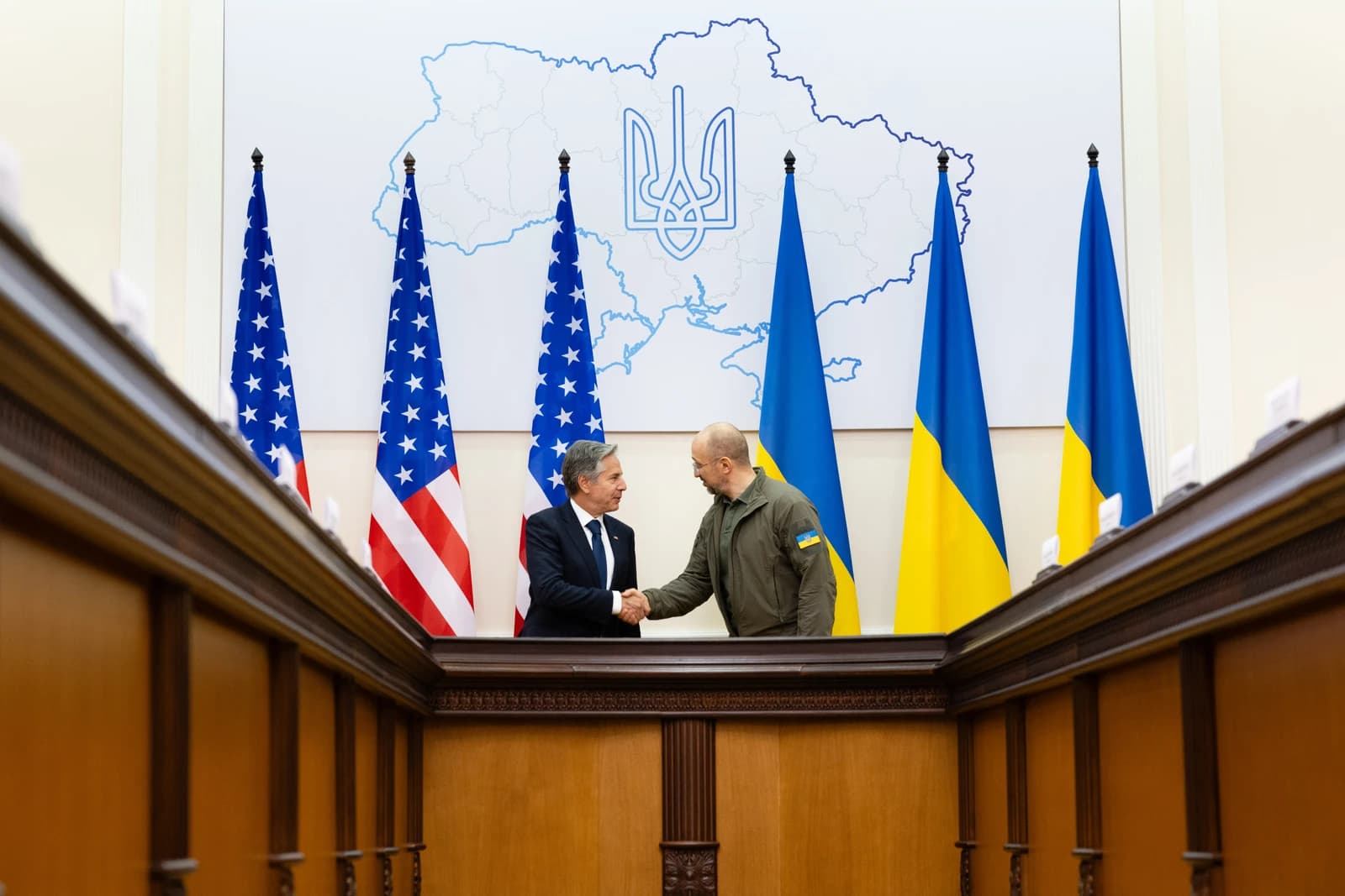 US Secretary of State Antony Blinken shakes hands with Ukrainian Prime Minister Denys Shmyhal.