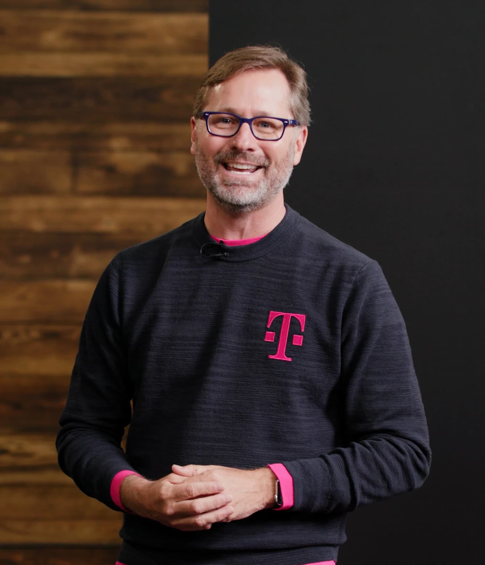Mike Sievert, CEO of T-Mobile US, smiling at an event.