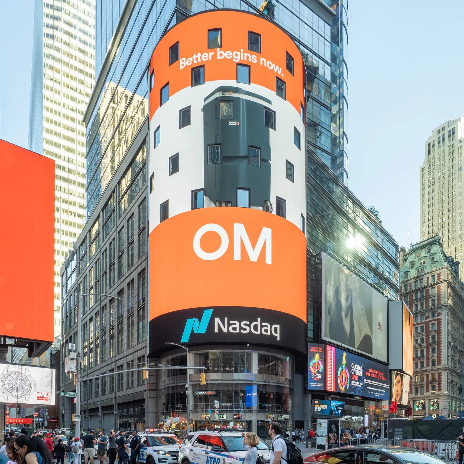 Exterior view of the Nasdaq MarketSite building with large digital displays in Times Square.