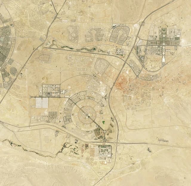 Aerial satellite image showing the sprawling urban development of Egypt's New Administrative Capital.