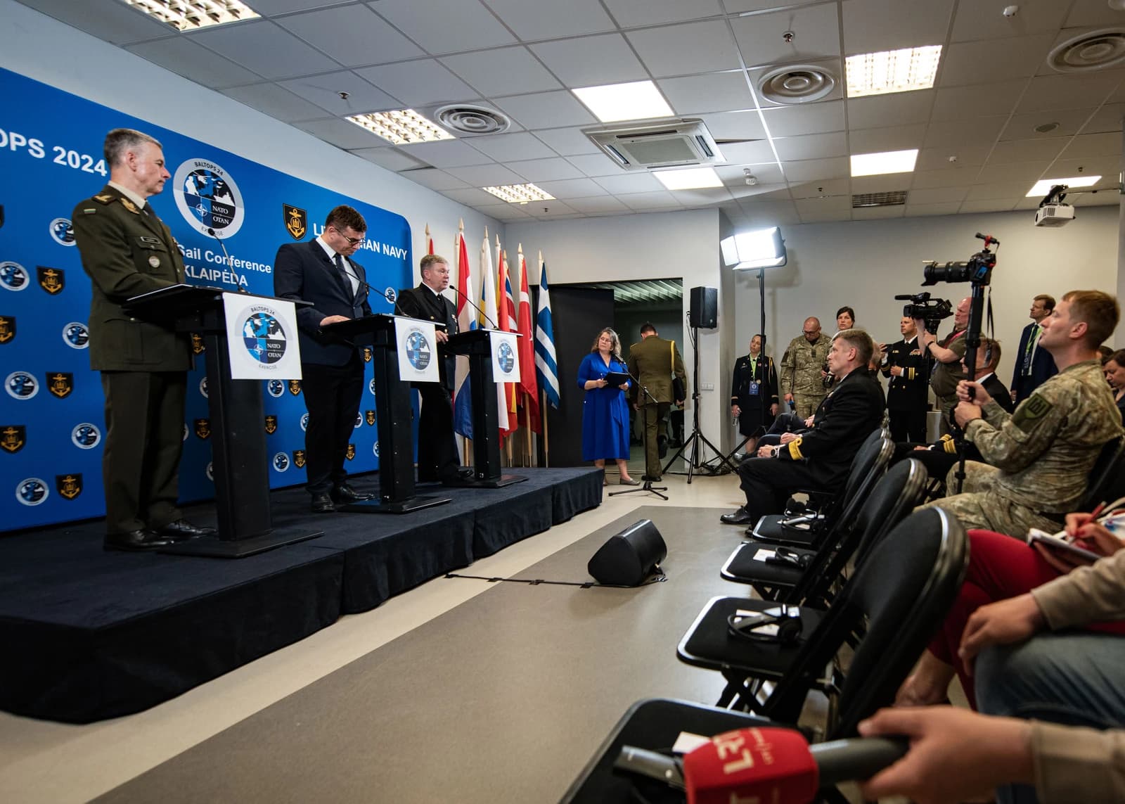 Military and government officials speak at podiums during the BALTOPS 2024 pre-sail conference.