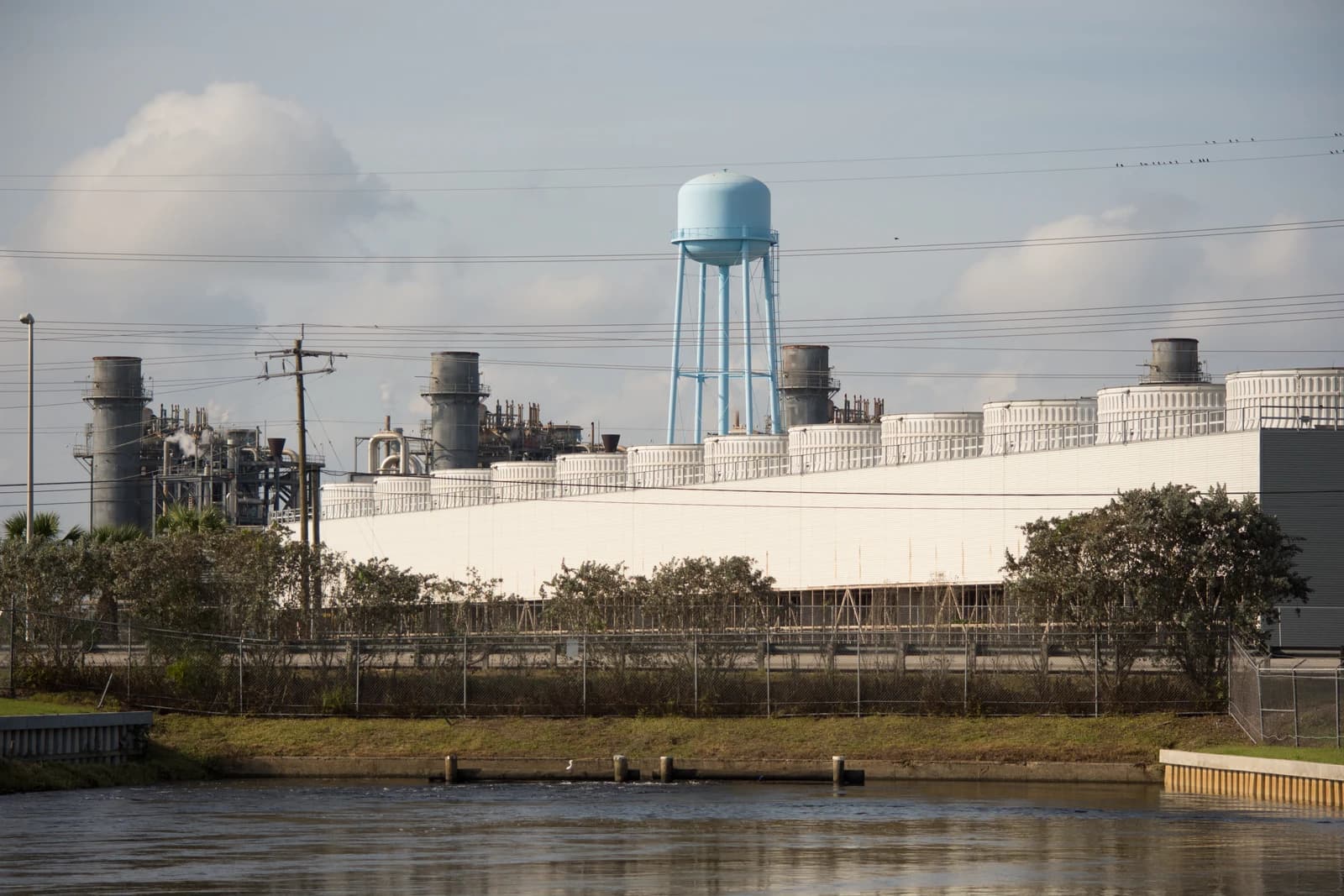FPL power plant with cooling towers and water tank in Fort Myers, Florida.