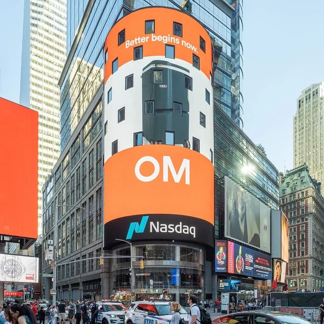 Nasdaq MarketSite building with multiple digital billboards showing advertisements in Times Square, New York.