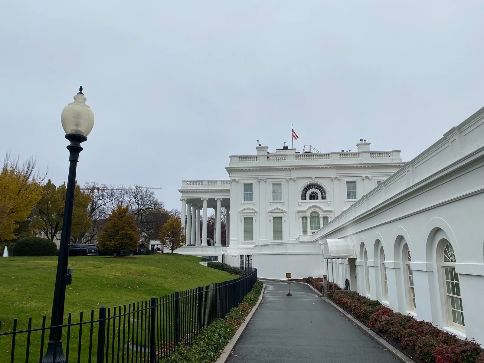Exterior view of the White House West Wing on a cloudy day.