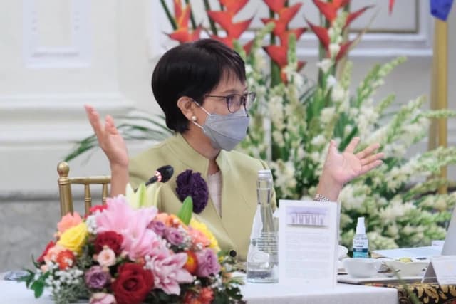 Retno Marsudi, Indonesian Foreign Minister, gestures while speaking at a meeting.