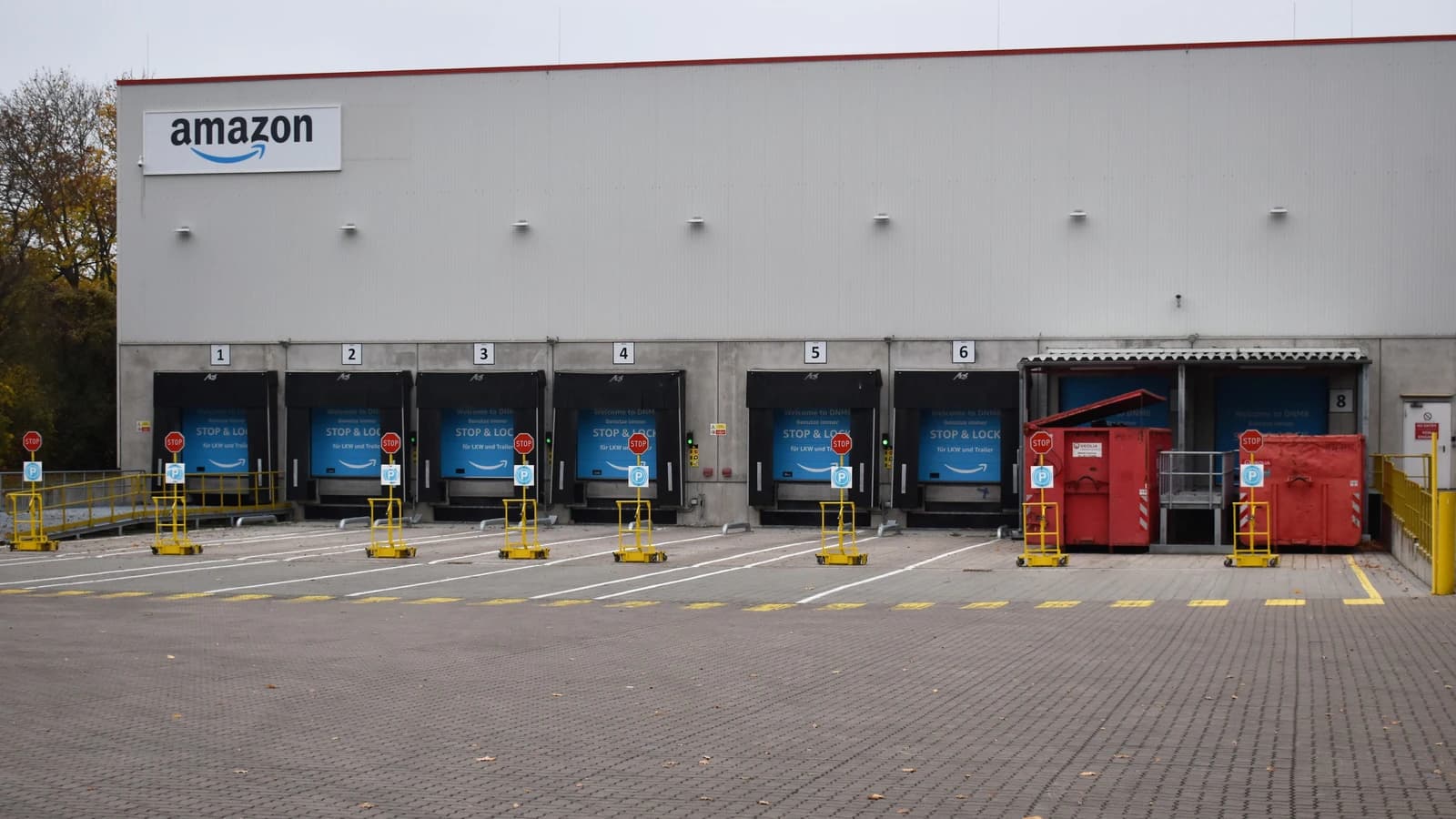 Exterior of an Amazon warehouse showing multiple loading docks.