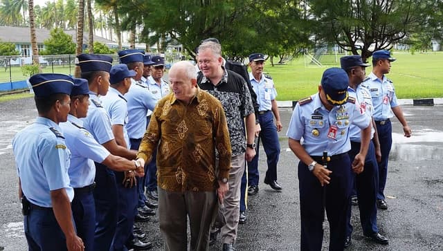 Ambassador Donovan shaking hands with uniformed Indonesian military personnel during a visit.