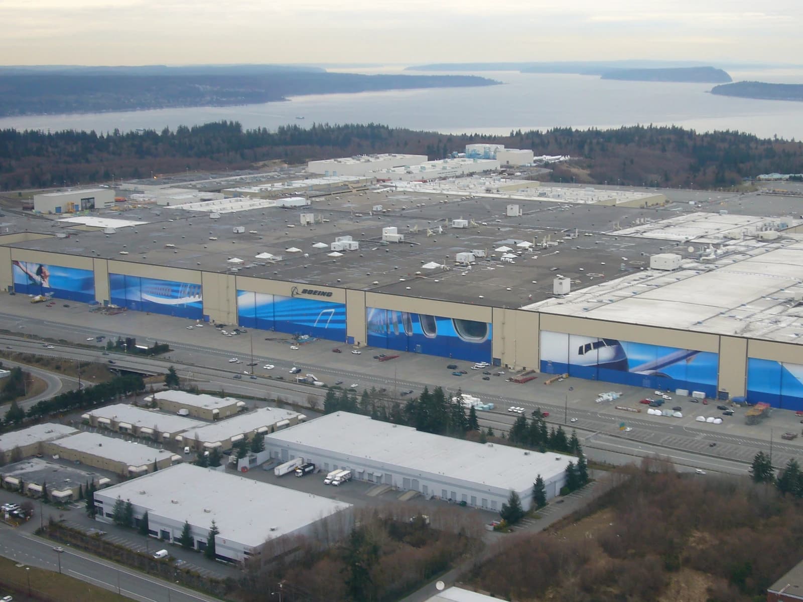 Aerial view of the sprawling Boeing Everett Plant with the Puget Sound in the background.