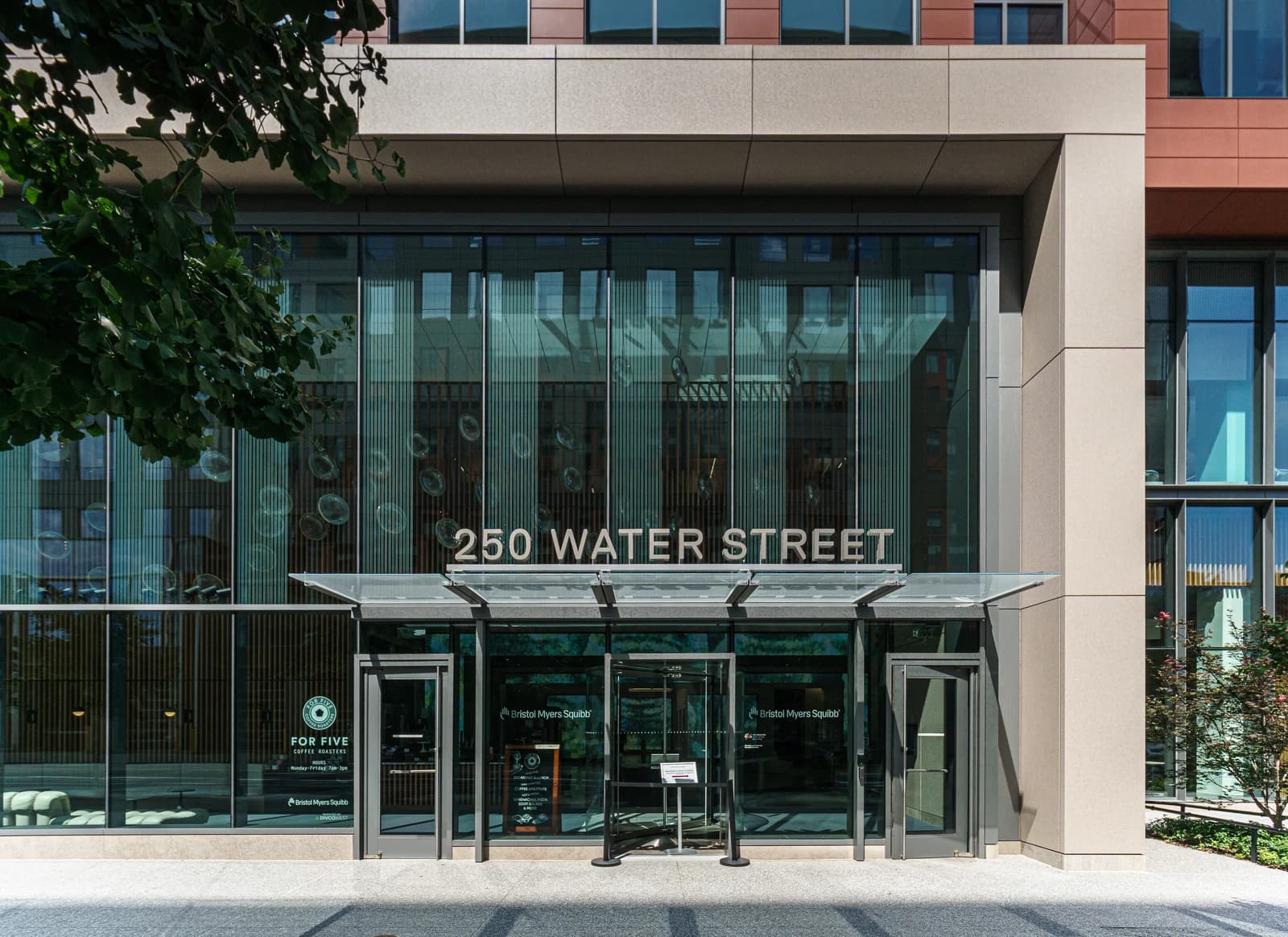 Exterior of the Bristol Myers Squibb building at 250 Water Street in Cambridge, Massachusetts.