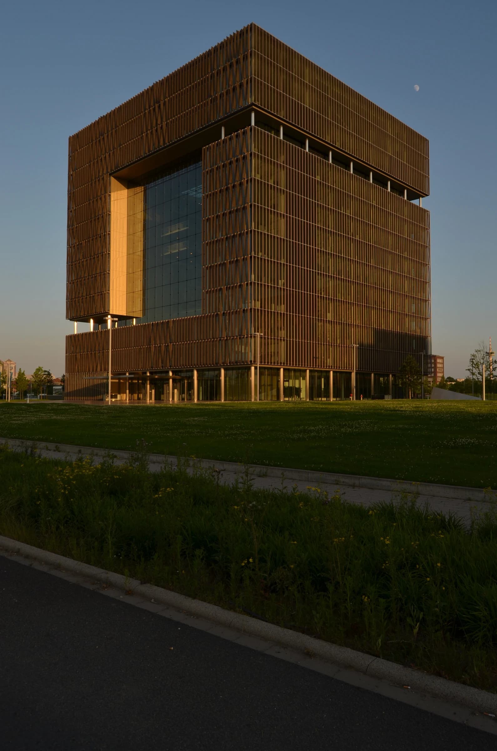 ThyssenKrupp headquarters building in Essen, Germany, with grass and a road in foreground.