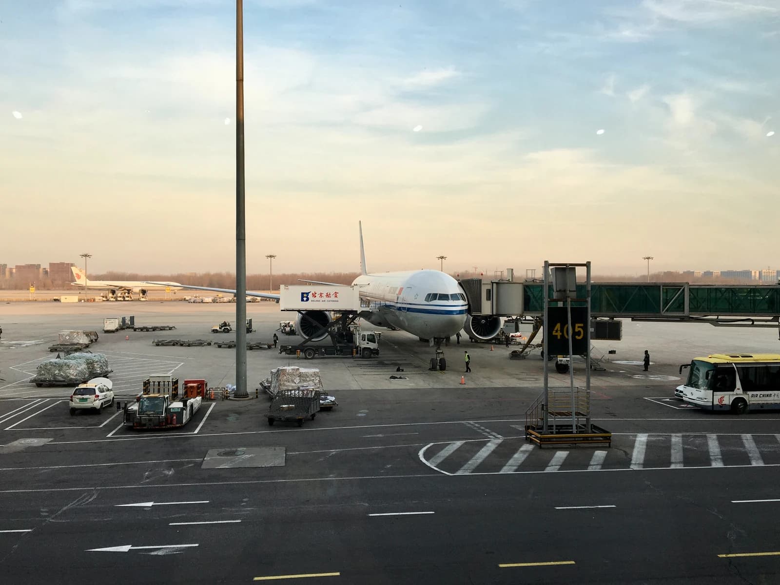 An Air China Boeing 777-300 aircraft parked at a gate at Beijing Capital International Airport.