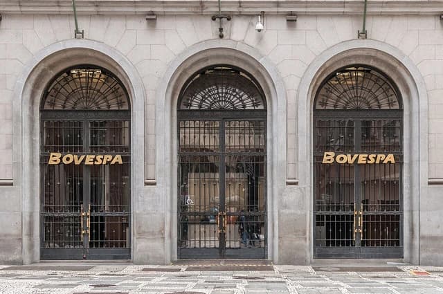 Exterior view of the Bovespa stock exchange building in São Paulo with arched windows.