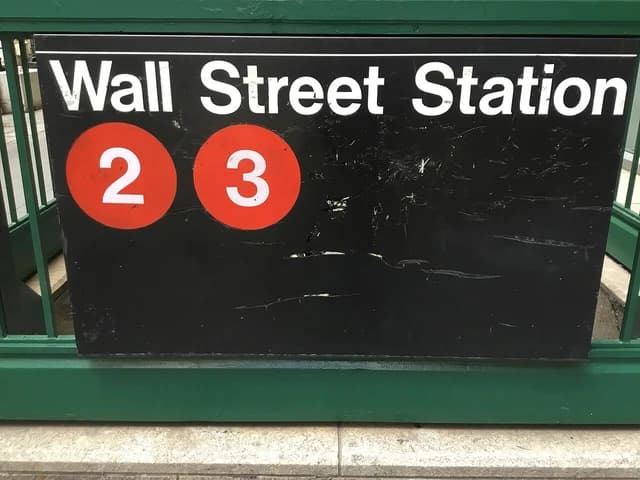 Wall Street Station subway sign with train numbers 2 and 3.