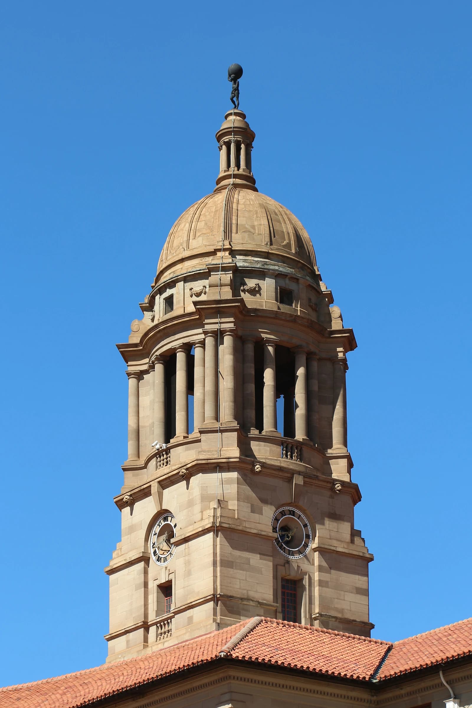 East tower of the Union Buildings in Pretoria, South Africa, against a clear blue sky.