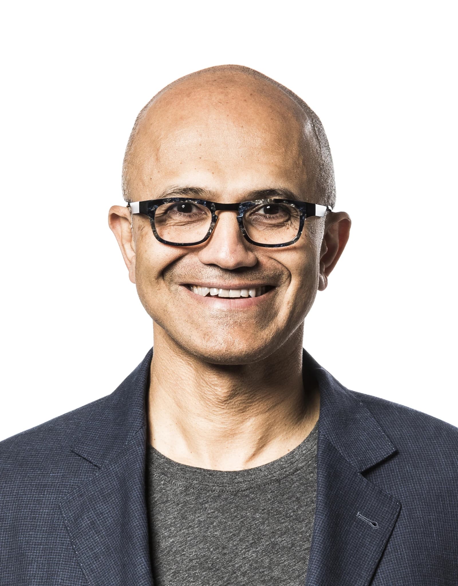 Satya Nadella, CEO of Microsoft, smiling and looking directly at the camera.
