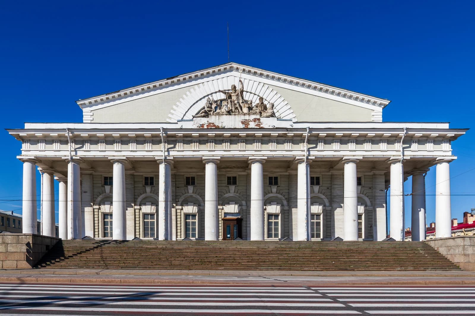 Old Saint Petersburg Stock Exchange building, front view with columns and steps.