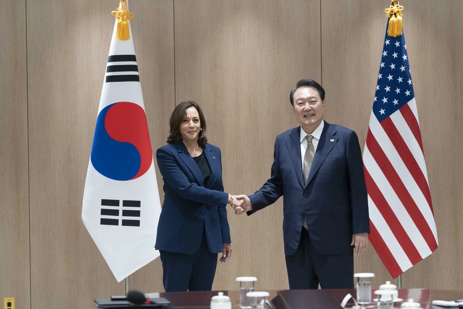 Vice President Kamala Harris shakes hands with South Korean President Yoon Suk-yeol in Seoul.