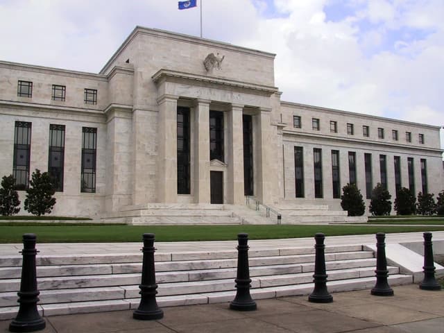 Marriner S. Eccles Federal Reserve Board Building headquarters exterior with stairs and columns.