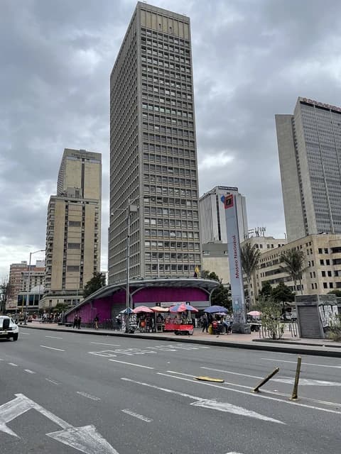 Skyscrapers and a street with a subway station entrance in Bogota.