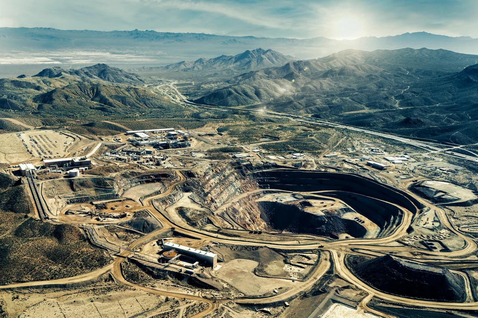 Aerial view of the Mountain Pass Rare Earth Mine, with mining operations visible.