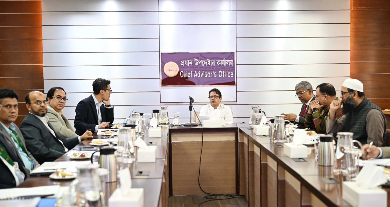Group of men attending a meeting at the Chief Advisor's Office in Dhaka, Bangladesh.