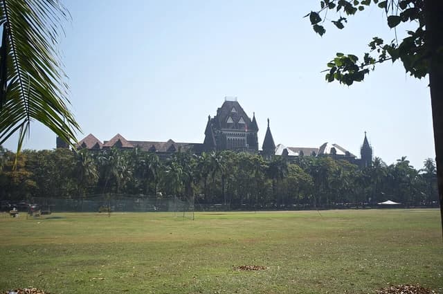 Bombay High Court building viewed from the Oval Maidan in Mumbai, India.