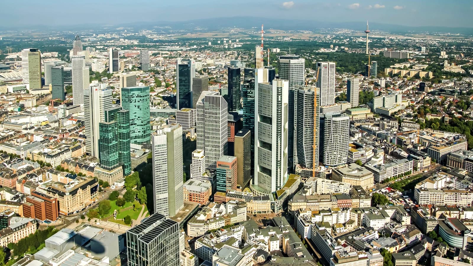 An aerial view showing the skyscrapers and urban landscape of Frankfurt am Main, Germany.